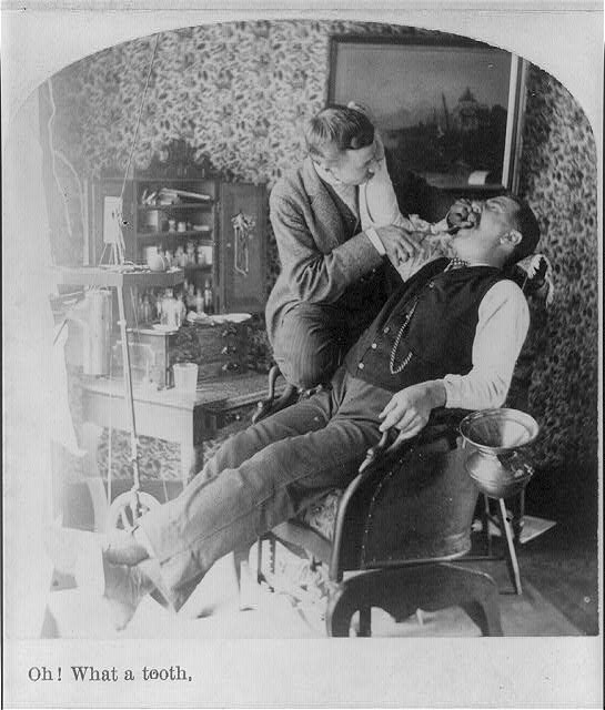 Man in historical dentist chair