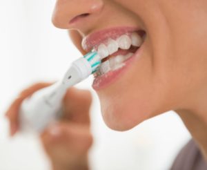 person brushing teeth