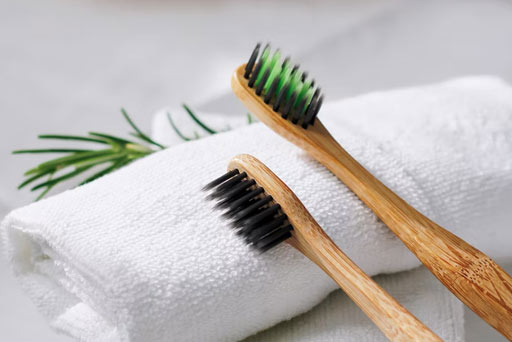 toothbrushes resting on a towel