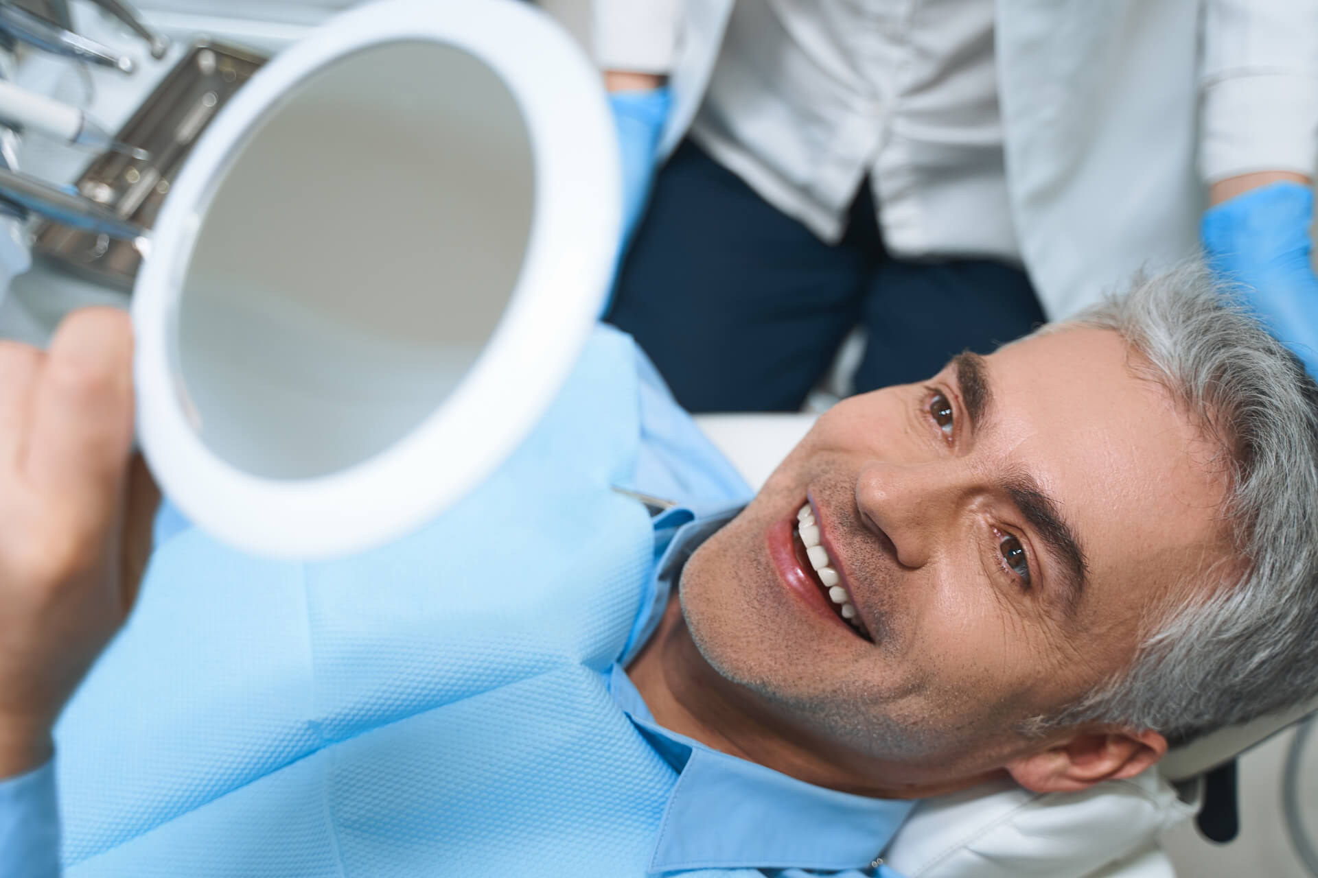 A man getting veneers at his local dentist's office